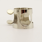 A nickel-plated APM 332N clarinet ligature featuring a traditional two-screw adjustment system, displayed at MusicMasters in Tallahassee, Florida.