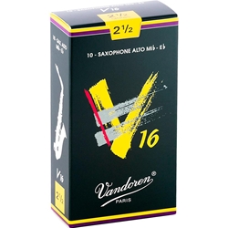 An individual Vandoren V16 Alto Saxophone reed strength 2.5 shown alongside its protective green packaging wrapper.