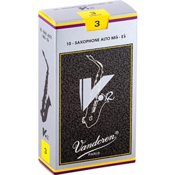 A single Vandoren V12 Alto Saxophone reed strength 3.0 resting on its factory protective sleeve wrapper.