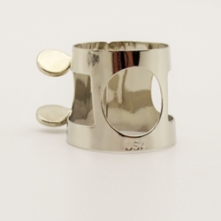 A nickel-plated APM 332N clarinet ligature featuring a traditional two-screw adjustment system, displayed at MusicMasters in Tallahassee, Florida.
