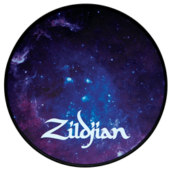 A six-inch circular Zildjian Galaxy practice pad showing a colorful outer-space design on a silicone surface with an integrated black base.